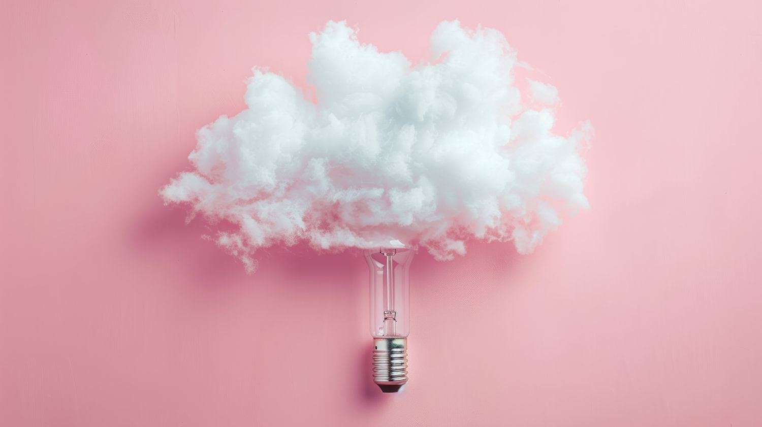 An unlit lightbulb with a fluffy cloud around the bulb on a pink background