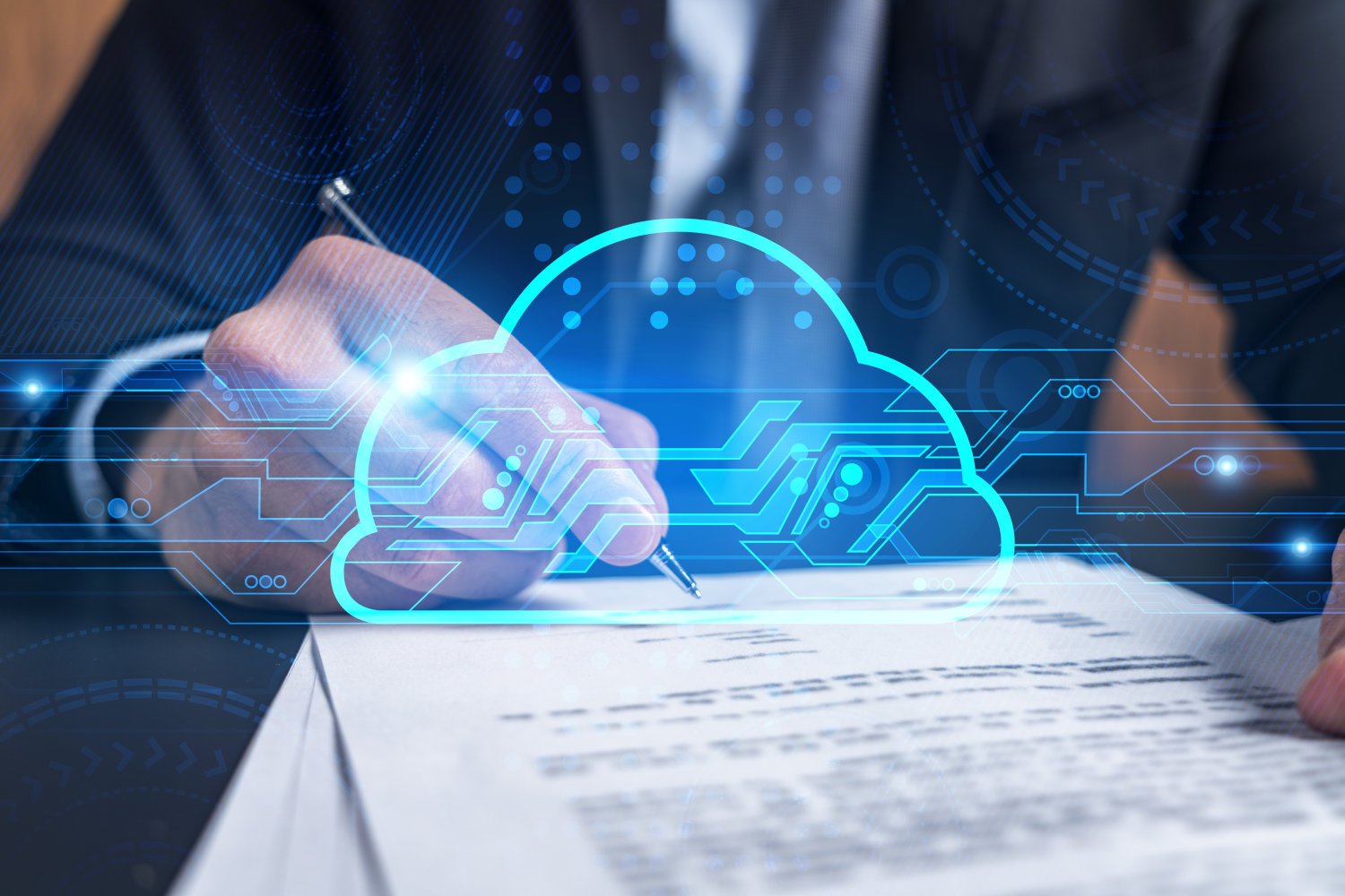 A person signing a contract with a pen and a blue cloud illustration superimposed over the image